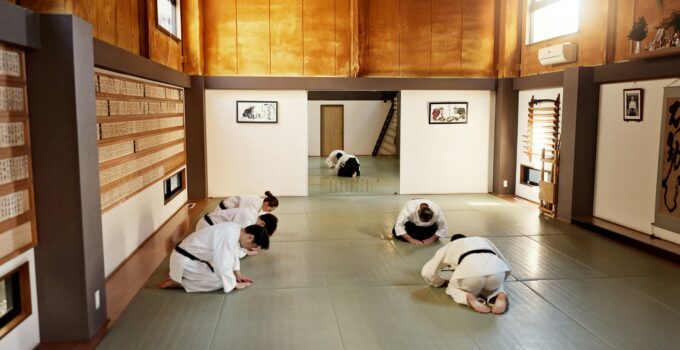 Students, aikido or teaching Japanese martial arts in dojo for practice, body movement or self defe